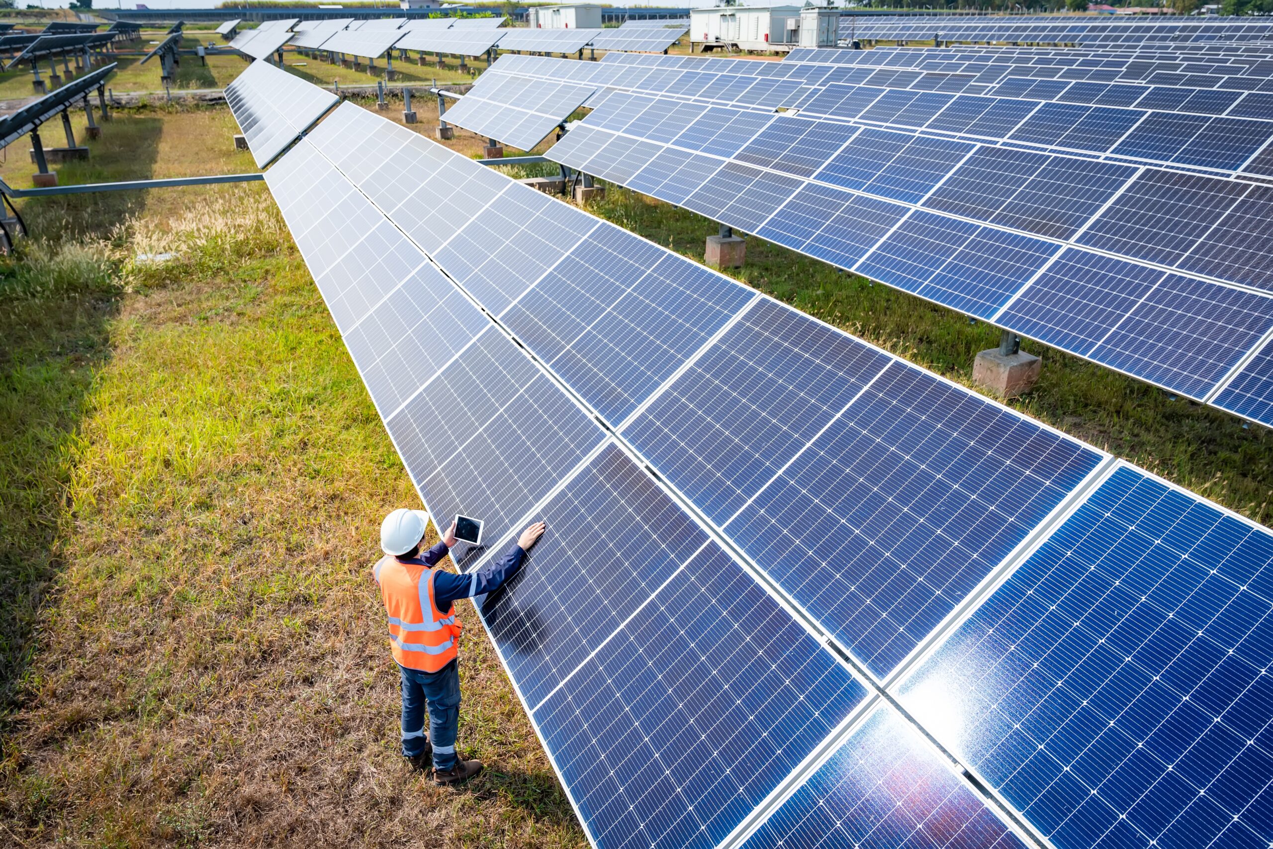 The,Solar,Farm(solar,Panel),With,Engineers,Check,The,Operation,Of
